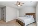 Bright bedroom with ceiling fan, neutral walls, and carpeted floors at 125 Atkins Ln, Fayetteville, GA 30215