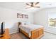 Comfortable bedroom with a decorative painting, ceiling fan and natural light at 125 Atkins Ln, Fayetteville, GA 30215
