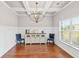 Elegant dining room featuring coffered ceilings, wainscoting, and hardwood floors at 125 Atkins Ln, Fayetteville, GA 30215