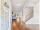 Inviting entryway featuring hardwood floors and staircase, leading into a bright living space at 125 Atkins Ln, Fayetteville, GA 30215