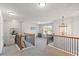 Upstairs hallway with railing and light fixture at 125 Atkins Ln, Fayetteville, GA 30215