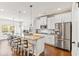 Well-appointed kitchen with a large island, stainless steel appliances, and adjacent dining area at 125 Atkins Ln, Fayetteville, GA 30215