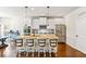 Spacious kitchen featuring a large island with barstool seating, stainless steel appliances, and white cabinetry at 125 Atkins Ln, Fayetteville, GA 30215