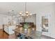 Bright eat-in kitchen features granite counters, stainless appliances, and an island with a sink at 125 Atkins Ln, Fayetteville, GA 30215