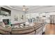 Open-concept living room flows into kitchen, featuring a fireplace, hardwood floors, and comfortable seating at 125 Atkins Ln, Fayetteville, GA 30215