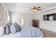 The main bedroom features modern fixtures, a comfy king-size bed, and stylish ceiling fan at 125 Atkins Ln, Fayetteville, GA 30215