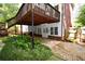 Exterior view showcasing a deck and verdant landscaping, perfect for enjoying the outdoors at 1858 De Winton Pl, Lawrenceville, GA 30043