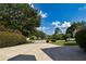Long driveway leading to a home with well-manicured landscaping and mature trees at 1858 De Winton Pl, Lawrenceville, GA 30043