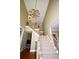 A grand foyer with a chandelier, staircase, and high ceilings that create an open and inviting entrance at 1858 De Winton Pl, Lawrenceville, GA 30043