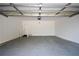 Spacious garage with ample room for parking and storage, featuring an automatic door opener at 1858 De Winton Pl, Lawrenceville, GA 30043