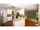 Beautiful kitchen featuring granite countertops, stainless steel appliances, and an open layout to the living area at 1858 De Winton Pl, Lawrenceville, GA 30043