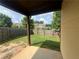 The backyard features a small grassy area, a wooden fence, and a covered patio at 2423 Turnbury Glen Walk, Snellville, GA 30078