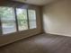 Bedroom features neutral carpeting, providing a cozy and comfortable space at 2423 Turnbury Glen Walk, Snellville, GA 30078