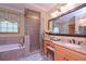 Bright bathroom featuring a separate shower, bathtub and tiled floors at 3743 Johnston Rd, Winston, GA 30187