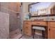 Bright bathroom featuring a separate shower with bench and granite countertops at 3743 Johnston Rd, Winston, GA 30187