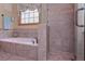 Bathroom showing tiled floors and bathtub in a separate shower space at 3743 Johnston Rd, Winston, GA 30187