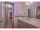 Well-lit bathroom with a vanity and sink, decorated with floral wallpaper at 3743 Johnston Rd, Winston, GA 30187