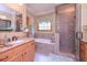 Bathroom with a separate shower, bathtub and tiled floors at 3743 Johnston Rd, Winston, GA 30187