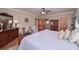 Inviting bedroom with hardwood floors, a ceiling fan, and access to the bathroom at 3743 Johnston Rd, Winston, GA 30187
