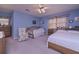 Bright bedroom featuring a floral armchair and windows allowing for ample natural light at 3743 Johnston Rd, Winston, GA 30187