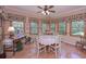 Bright breakfast nook with hardwood floors, many windows with decorative floral valances at 3743 Johnston Rd, Winston, GA 30187