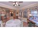 Bright breakfast nook with hardwood floors, many windows and access to the kitchen at 3743 Johnston Rd, Winston, GA 30187