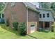 Back exterior view of home with a garage and walk out basement at 3743 Johnston Rd, Winston, GA 30187