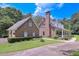 Brick home with an attached garage and a cozy covered front porch at 3743 Johnston Rd, Winston, GA 30187