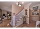 Elegant foyer with a staircase, hardwood floors, and a classic chandelier at 3743 Johnston Rd, Winston, GA 30187
