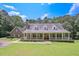 Charming home featuring a welcoming front porch, lush landscaping, and a well-manicured lawn at 3743 Johnston Rd, Winston, GA 30187