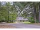 This beautiful home features a long driveway leading to a welcoming covered front porch at 3743 Johnston Rd, Winston, GA 30187