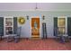 Cozy front porch with rocking chairs, charming decor, and a welcoming entrance at 3743 Johnston Rd, Winston, GA 30187