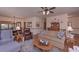 Bright living room featuring comfortable seating, elegant decor, and a view into the dining area at 3743 Johnston Rd, Winston, GA 30187