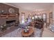 Cozy living room features a brick fireplace, comfortable seating, and a warm, inviting atmosphere at 3743 Johnston Rd, Winston, GA 30187