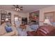 Comfortable living room with a brick fireplace, plush seating, and a ceiling fan at 3743 Johnston Rd, Winston, GA 30187