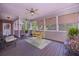 Screened porch with comfortable seating arrangement with views of the outdoors at 3743 Johnston Rd, Winston, GA 30187