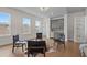 Bright living room with modern finishes, wood floors, and a stylish built-in bar area at 89 Batten Board Way, Woodstock, GA 30189