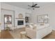 Comfortable living room featuring a fireplace, neutral tones, and contemporary decor at 89 Batten Board Way, Woodstock, GA 30189