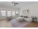 Bright living room with large windows, neutral tones, and stylish, comfortable furnishings at 89 Batten Board Way, Woodstock, GA 30189