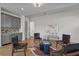 Bright living room featuring stylish decor, hardwood floors, and a functional bar with stainless steel appliances at 89 Batten Board Way, Woodstock, GA 30189