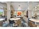 Brightly lit club lounge featuring tables and modern decor at 89 Batten Board Way, Woodstock, GA 30189