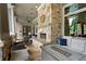 Inviting outdoor area with a stone fireplace, comfortable seating, and a serene ambiance at 89 Batten Board Way, Woodstock, GA 30189