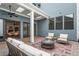 Inviting outdoor patio area with comfortable seating, ceiling fans, and ample natural light at 89 Batten Board Way, Woodstock, GA 30189