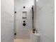 Modern shower features marble tile, dual shower heads, and a corner bench at 89 Batten Board Way, Woodstock, GA 30189