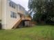 View of the backyard with deck and stairs to the grassy lawn at 11800 Carriage Park Ln, Johns Creek, GA 30097