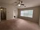 Large bedroom with ceiling fan and window at 11800 Carriage Park Ln, Johns Creek, GA 30097