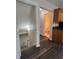 Hallway view showing staircase and half bathroom at 11800 Carriage Park Ln, Johns Creek, GA 30097
