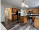 Bright kitchen features stainless steel appliances, light wood cabinets, and center island at 11800 Carriage Park Ln, Johns Creek, GA 30097