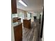 Spacious kitchen with stainless appliances, granite countertops and seamless flow to living room at 11800 Carriage Park Ln, Johns Creek, GA 30097
