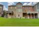 Townhome backyard featuring green grass and private wooden decks at 1160 Newpark View Pl # 8, Mableton, GA 30126